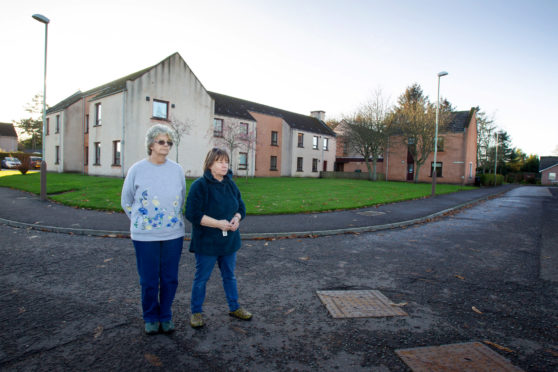 Residents Beth Smith (left) and Renata Ralph remain at Inglis Court.


....Pic Paul Reid

Remaining residents of Inglis Court in Edzell say they have been left in the dark over the plans for the programme to replace the sheltered housing scheme with 20 new homes. In October 2018 the tenants were promised a "bespoke service" to find them alternative homes in advance of the housing being demolished, but are now facing a second Christmas without having been offered suitable accommodation. Council say their plans remain on track with demolition due to start next year.