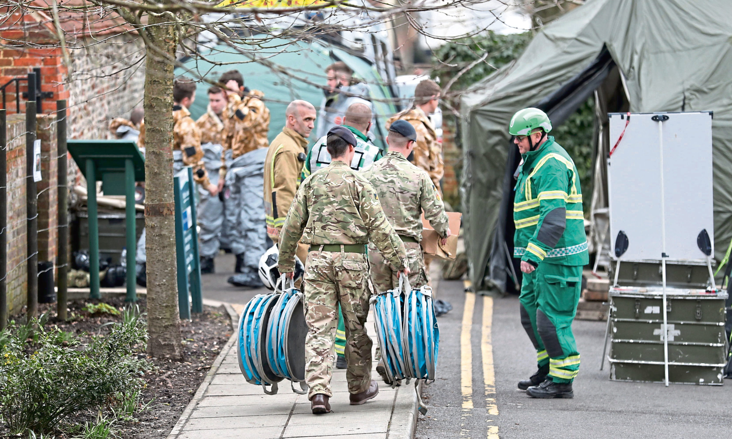 Military and emergency services personnel outside Bourne Hill police station in Salisbury, as police and members of the armed forces probe the suspected nerve agent attack on Russian double agent Sergei Skripal.