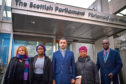 The mother of Sheku Bayoh, Aminata Bayoh (2ndR) brother in law Adey Emi Johnson, his sister Adama Kadijartu Johnson Lawyer Aamer Anwar and Debrah Cole director of inquest arrive at the Scottish Parliament for a meeting with First Minister Nicola Sturgeon and Justice Secretary Humza Yousaf .