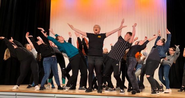 Paula Milne, centre, with the panto cast during rehearsals.