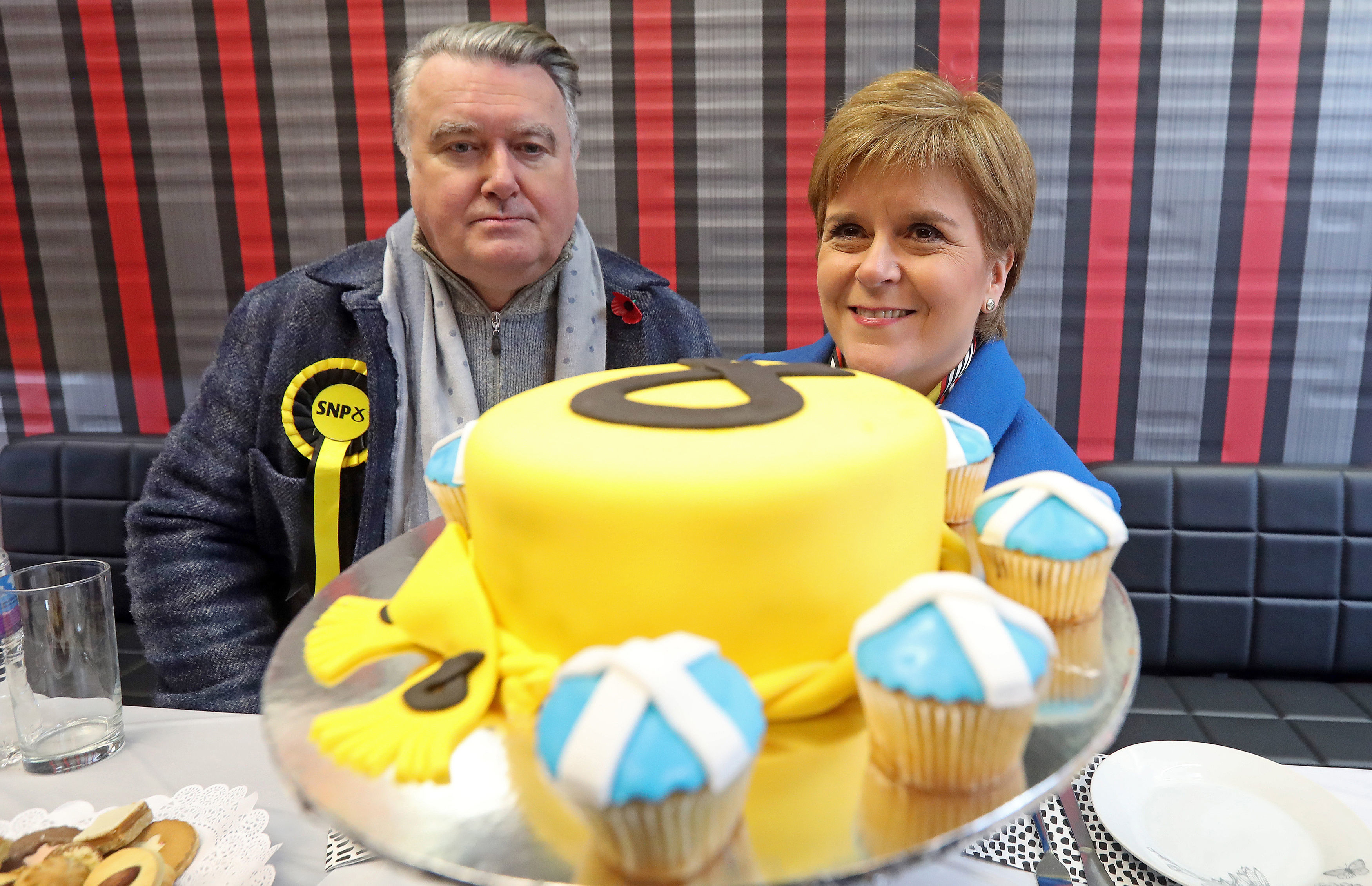 First Minister Nicola Sturgeon with Ochil & South Perthshire candidate John Nicolson during a visit to a bakery whilst on the election campaign trail in Alloa.