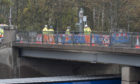 Engineers carried out an investigation at the bridge yesterday.
