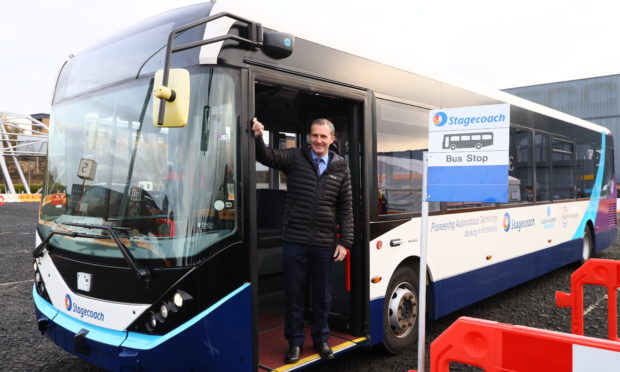 Michael Matheson on board the prototype bus.