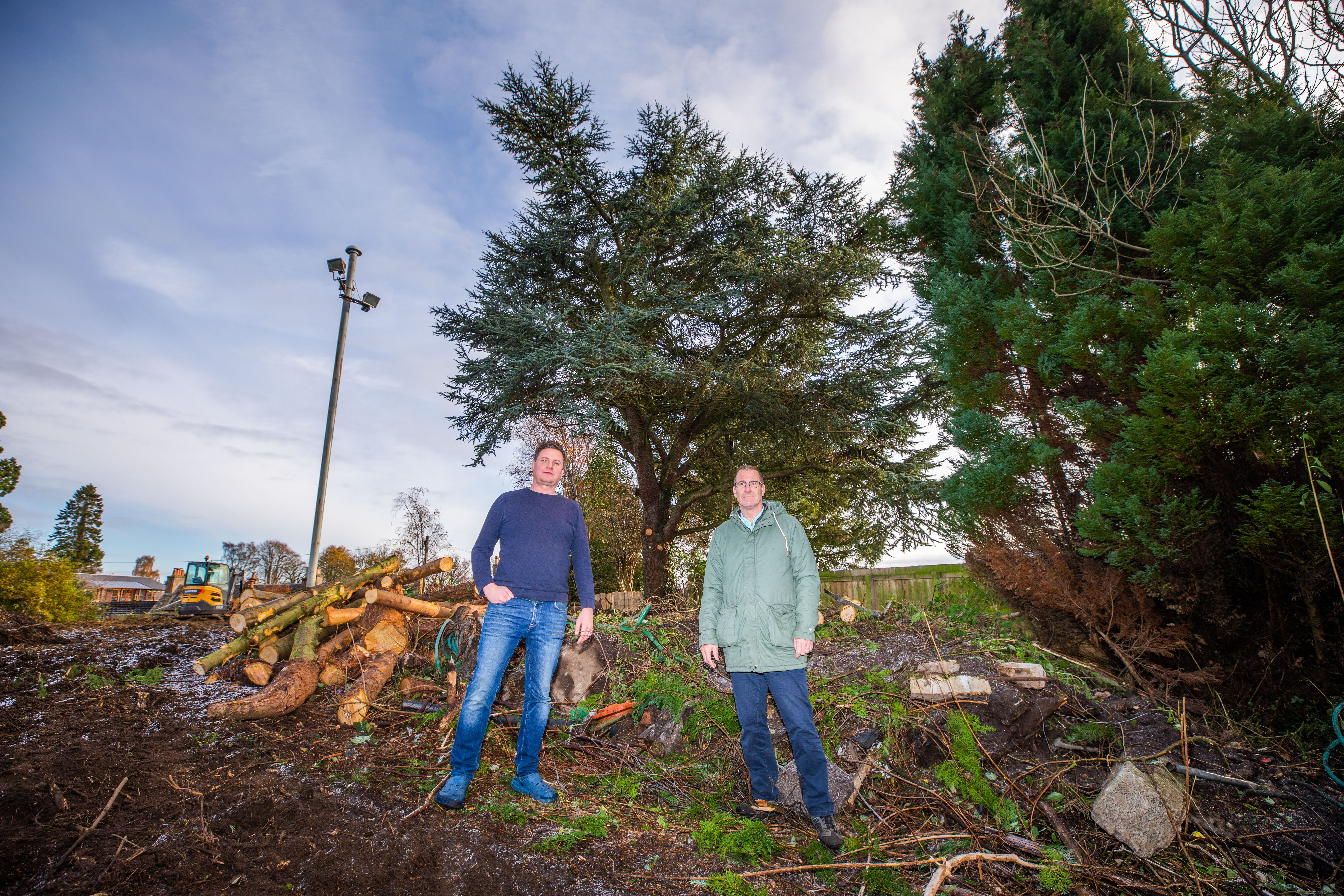 Richard McWhinney (left) and Peter Flett and trees marked for the chop