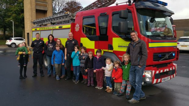 Firefighters with some of the pupils.