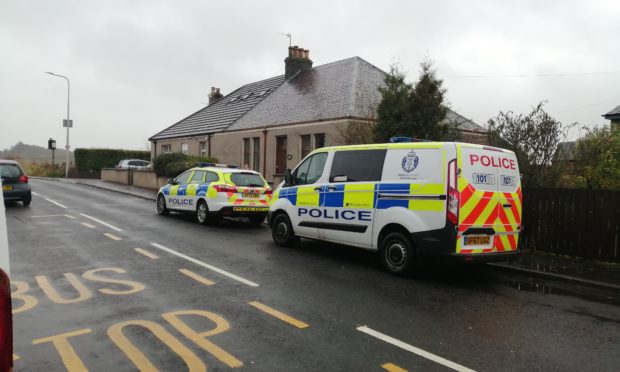 Police outside Annie Temple's home.