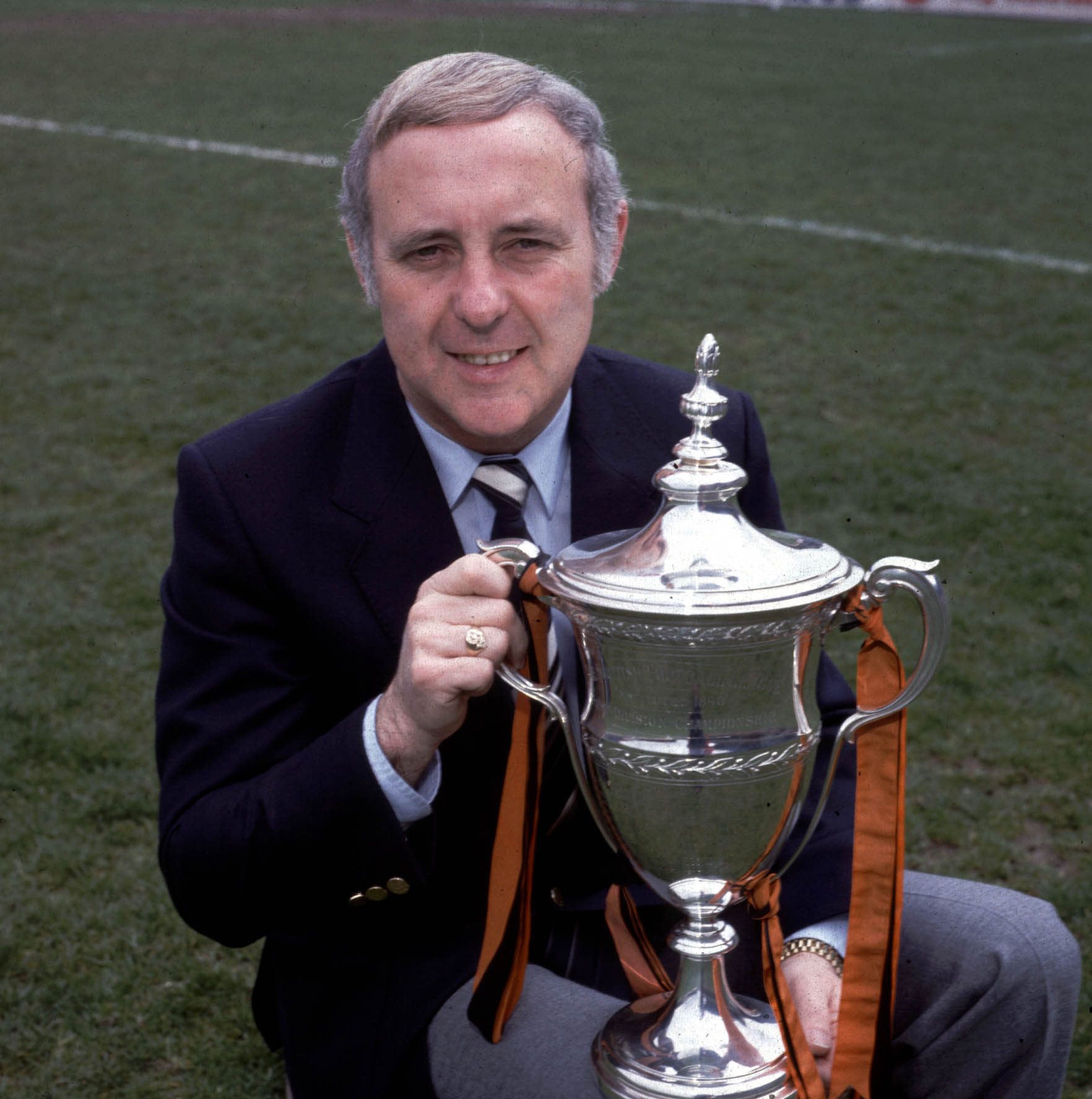 Jim McLean sits proudly with the Scottish Premier Division trophy, which his United side won in 1983.