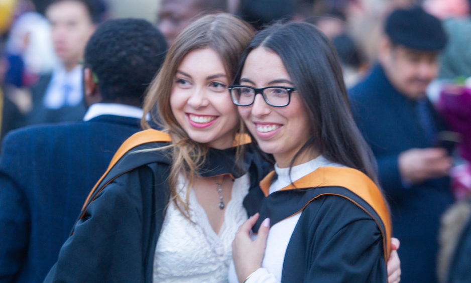 Graduates celebrate their success following the ceremony.