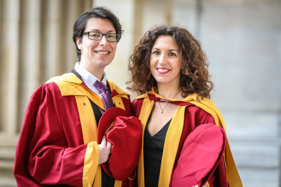 PHD graduates, Orion Mavridou and Konstantina Tsikrika outside the Caird Hall ahead of Abertay University's graduation ceremony.