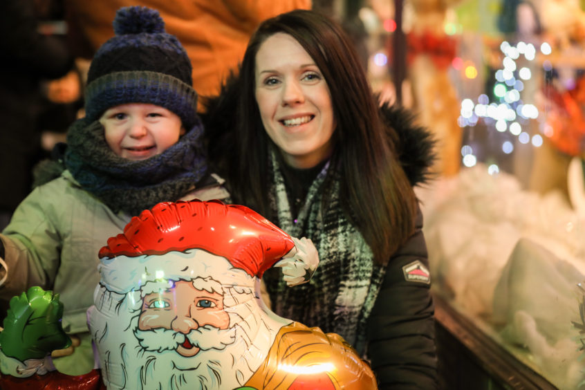 Cole and Ashley Valentine enjoying the Gillies display at the Christmas light switch on.