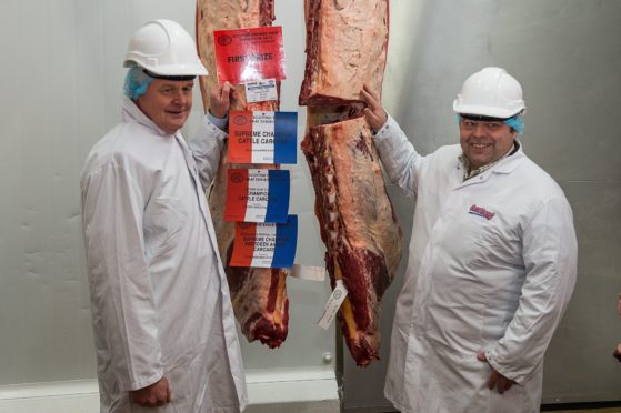 Gavin Ross, right, with judge Alan McNaughton and the overall carcase winner at Bridge of Allan.
