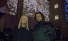 Artists Elizabeth Ogilvie and Rob Page with the projected art work.
