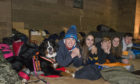 Students from Strathallan brave the elements with Burmese mountain dog Ella.