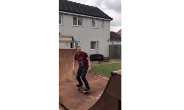 Ross Salitura practises his skateboard skills in his Kinglassie garden.