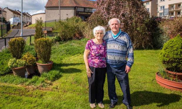Picture shows Stephen Murray and wife Amy Murray (aka Mary Murray) in their garden; the area behind them is constantly marshy and saturated.