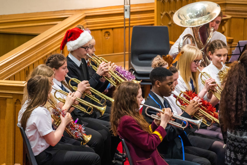 Pupils at Harris Academy and St John's RC High School perform in a concert at Dundee West Church