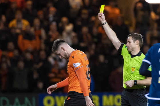 Calum Butcher is shown the yellow card for his challenge on Shaun Byrne.