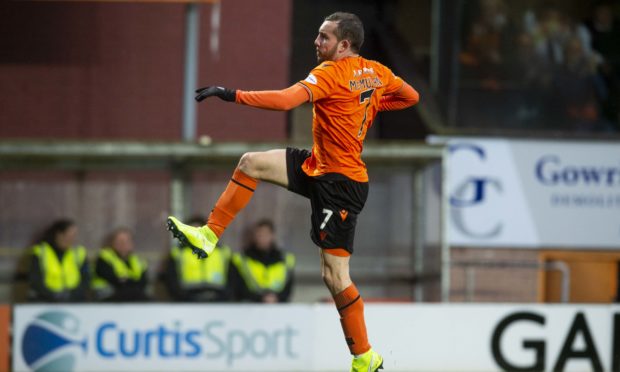 Paul McMullan takes to the air to celebrate his opening goal.