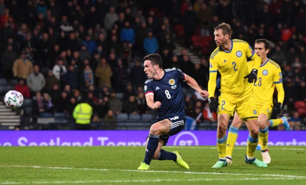 John McGinn makes it 3-1 during the UEFA European Championship Qualifier between Scotland and Kazakhstan at Hampden Park.