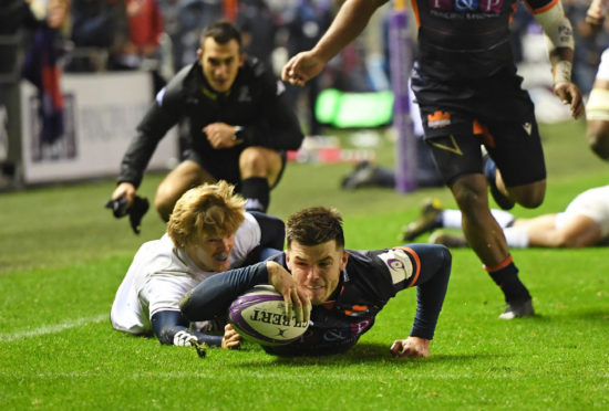 Blair Kinghorn scores the first half try for Edinburgh.