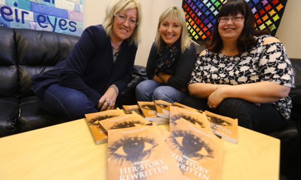 L/R, Janet Henderson, Jackie Shand and Fiona Dewar with copies of the book Her Story Rewritten