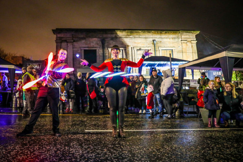 Think Circus performers Iain MacDonald and Jen Connolly perform.