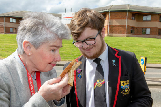 Councillor Mary Lockhart and pupil Bailey-Lee Robb (17) with one of the sub-standard sandwiches being served.