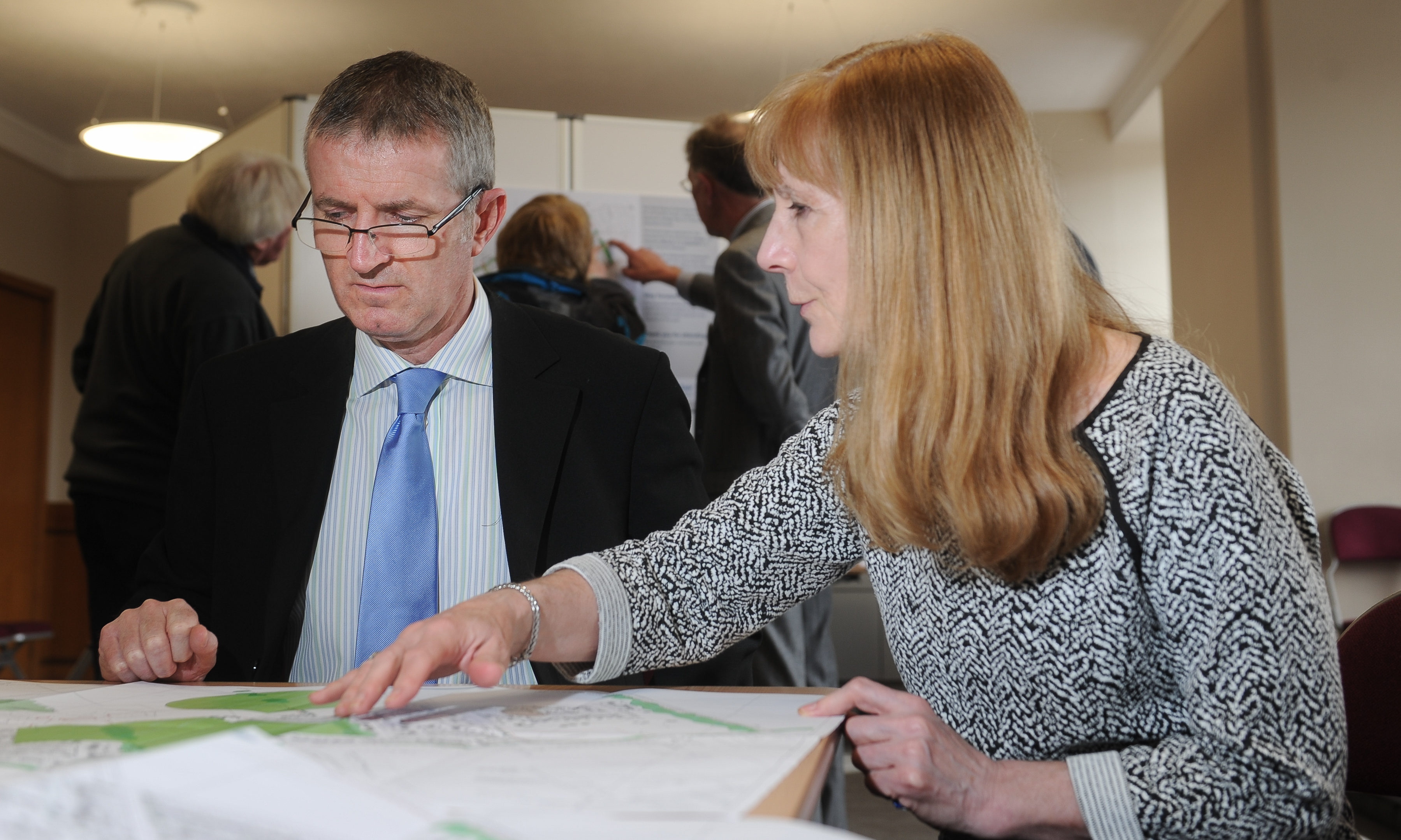 Public presentation on Planning Application Notice for major housing development at Westfield Loan, Forfar. Picture shows; l to r - member of the public, Euan Cameron discusses the plans with Jacquie Forbes (Consulting Architect for the project), Lesser Reid Hall, Forfar, Wednesday 02nd May 2018