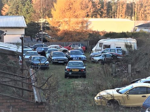 Cars parked behind the lock ups