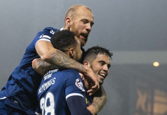 Declan McDaid celebrates a Kane Hemmings goal.