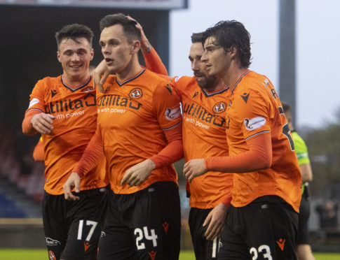 The United players celebrate the third goal.