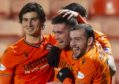 The Dundee United players celebrate Sam Stanton's goal.