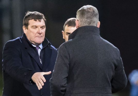 Tommy Wright shakes hands with Craig Levein.