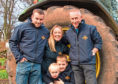 Daniel and Alison Milne with their sons and Norman Milne.