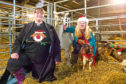 The Rev Maggie Hunt is going to conduct a special farmers’ Christmas carol service in Forfar Mart. She is pictured with Louise Nicoll, alpaca Bolt and goats Michael and Lucius.