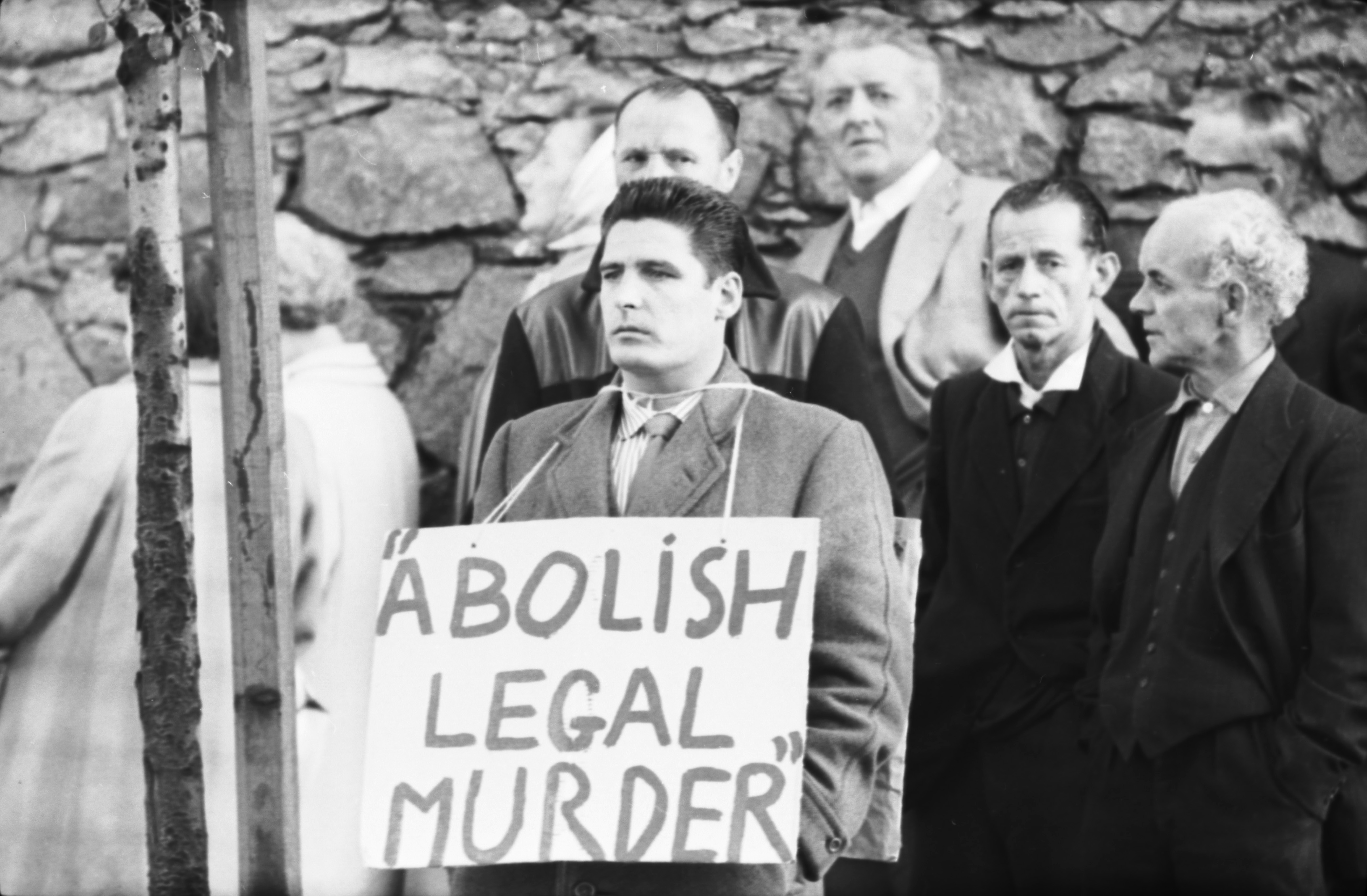 A man wears an 'Abolish Legal Murder' sign following the last-ever hanging in Scotland.