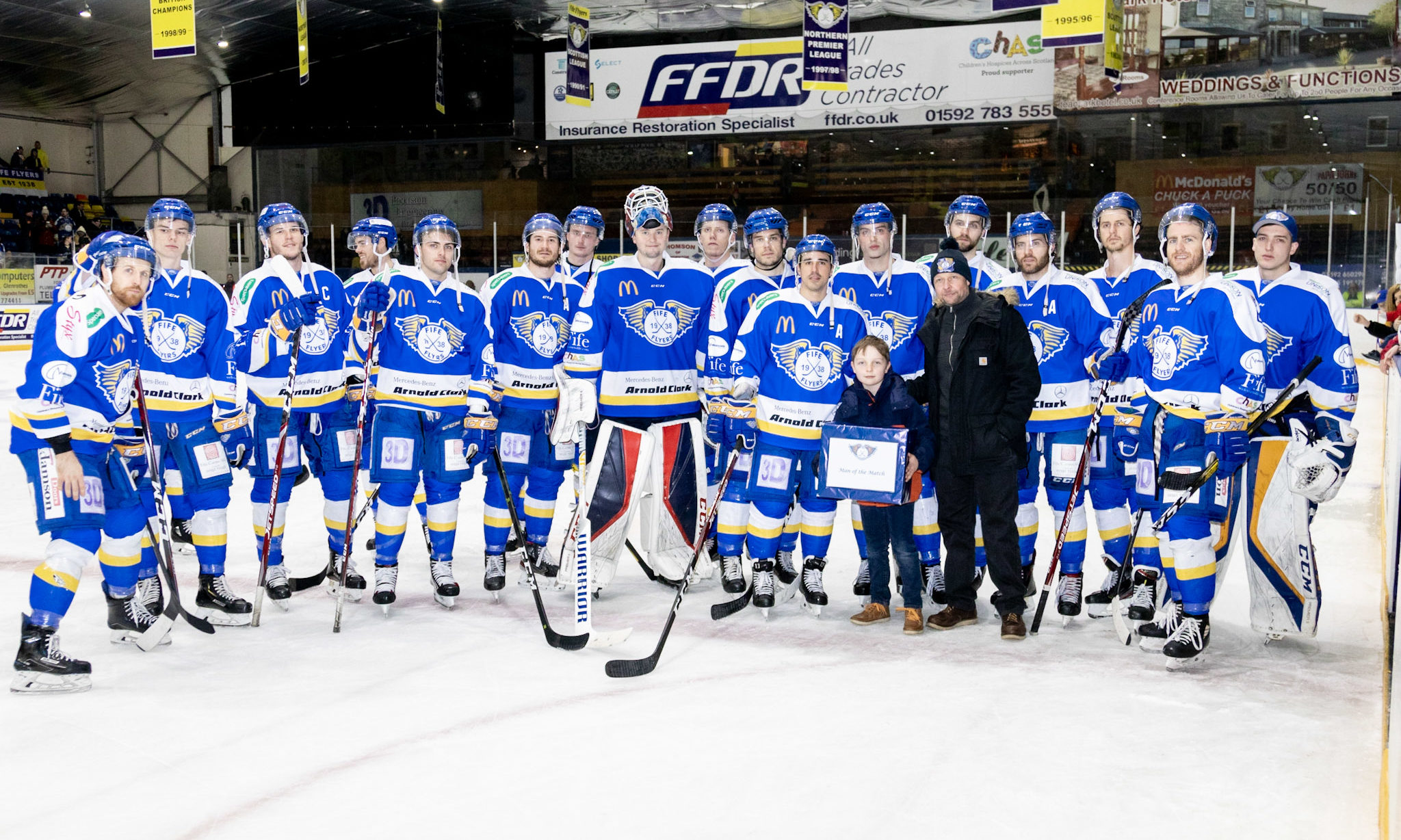 Archie and dad Walter with the Fife Flyers team.