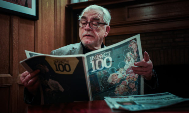 Brian Cox with a copy of The Courier Impact 100