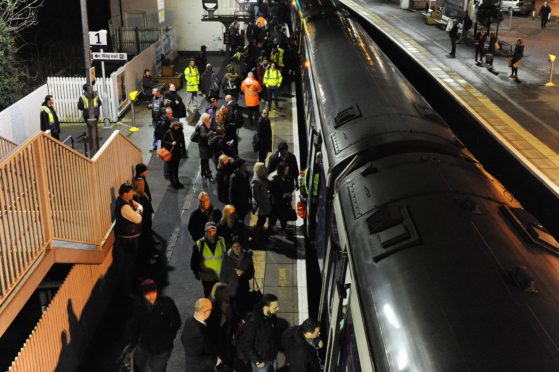 Inverkeithing railway station showing commuters waiting for trains