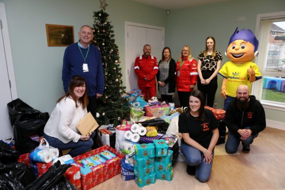 Pauline Buchan - Strategic Manager, Cottage Family Centre, Frank Hignett - Site Manager Bilfinger, Dougie Russell - CBRE, Yvonne Izatt - Training Advisor ExxonMobil, Tanya Scoon - Communications Consultant ExxonMobil, Kirsty Letham - Events Co-Ordinator Kingdom Kids, Lee Haston - Admin. Asst., Jackie Philip - Childcare Support Worker (both) Cottage Family Centre, and the Kingdom Kid.