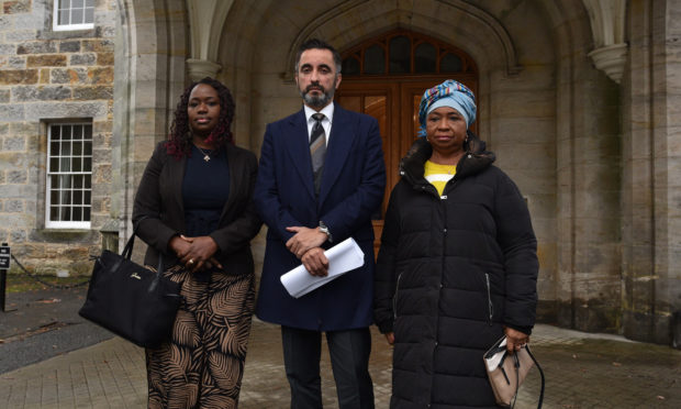 Mr Amwar with Kadi Johnston, left, and Aminata Bayoh.