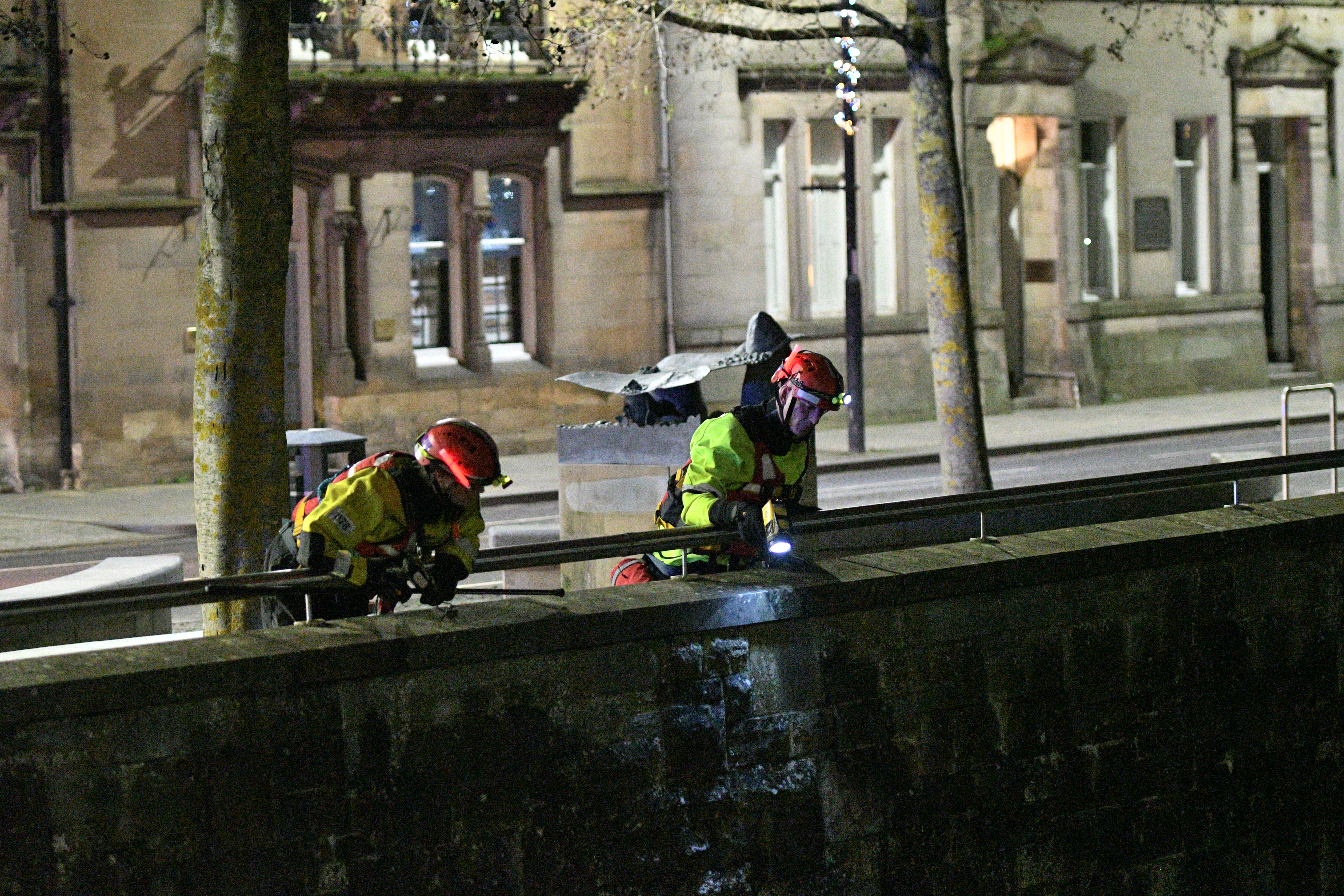Emergency officers conduct a search of the River Tay in Perth.