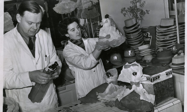 Preparing Red Herring.
Mr and Mrs William Gardyne preparing red herring for first-footing in 1957