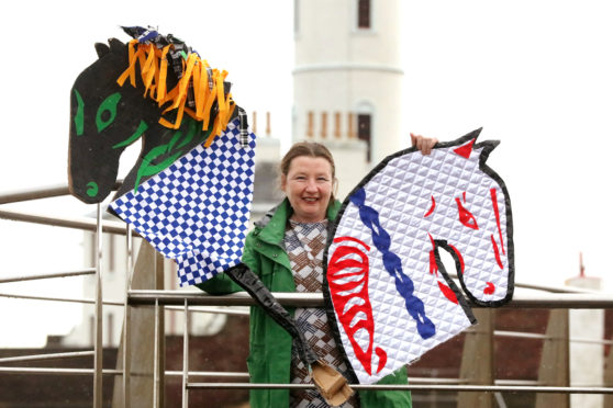 Artist Mandy Mcintosh with her version of the 'Arbroath Kelpies'.