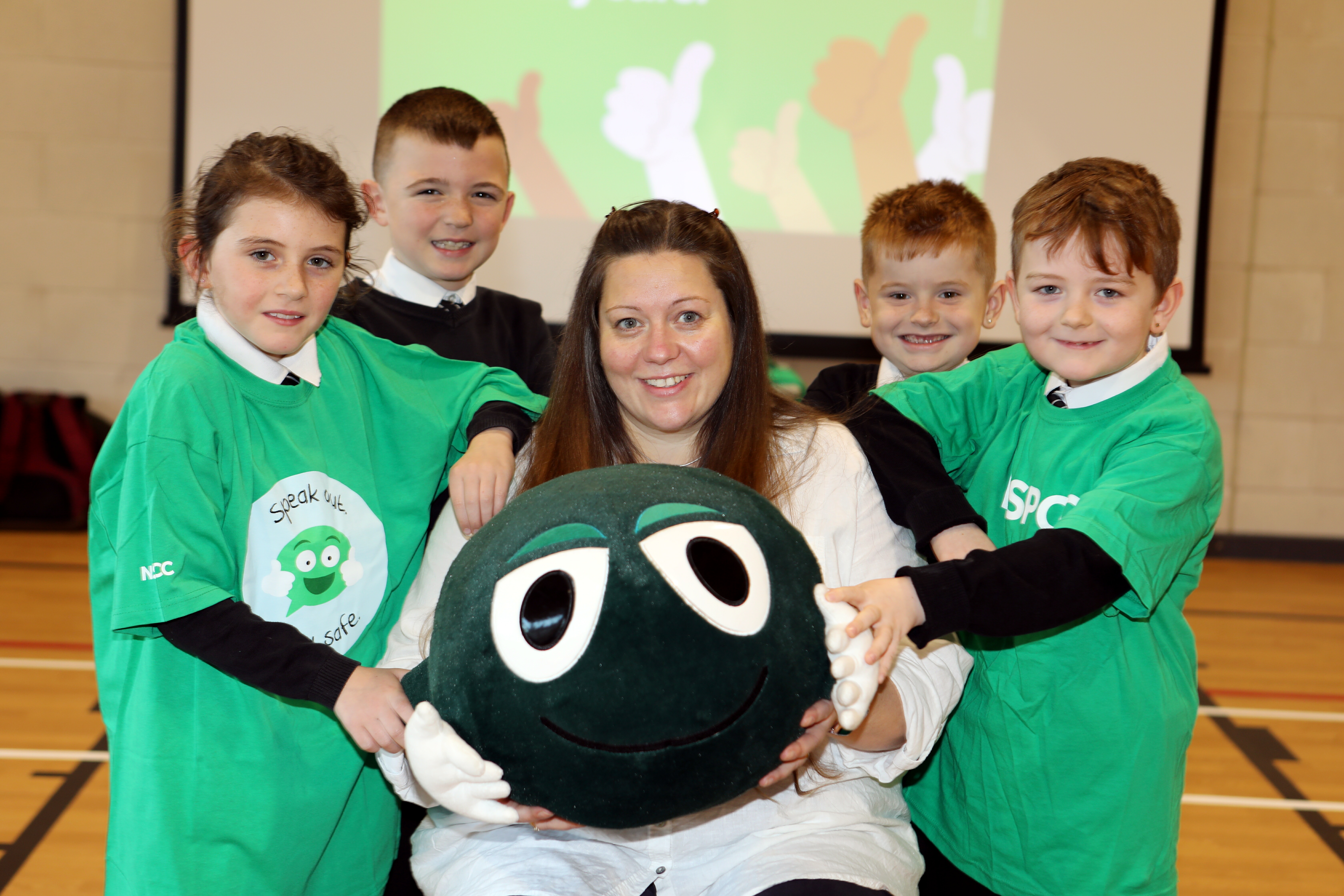 NSPCC Scotland's Heather Whyte, with Ladyloan P4 pupils Alex Gillespie, Jay Smith, Charlie King and Jacob Teasdale and Buddy the mascot.