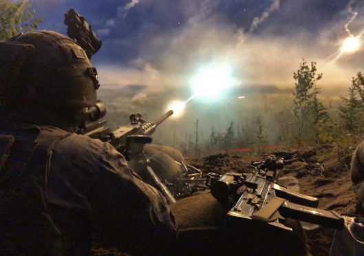 A 45 Commando Royal Marine firing a 50 calibre heavy machine gun in Estonia on Exercise Baltic Protector .