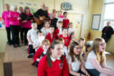 Guardbridge Primary pupils and members of A choir'd Taste perform Bill's song.