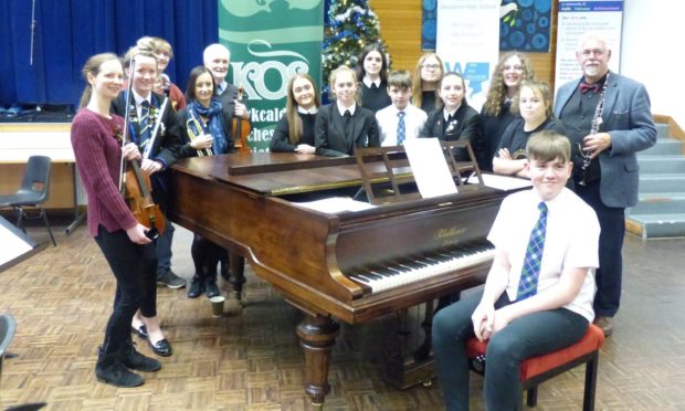 Mr Gourlay with young musicians from St Columbas High School.
