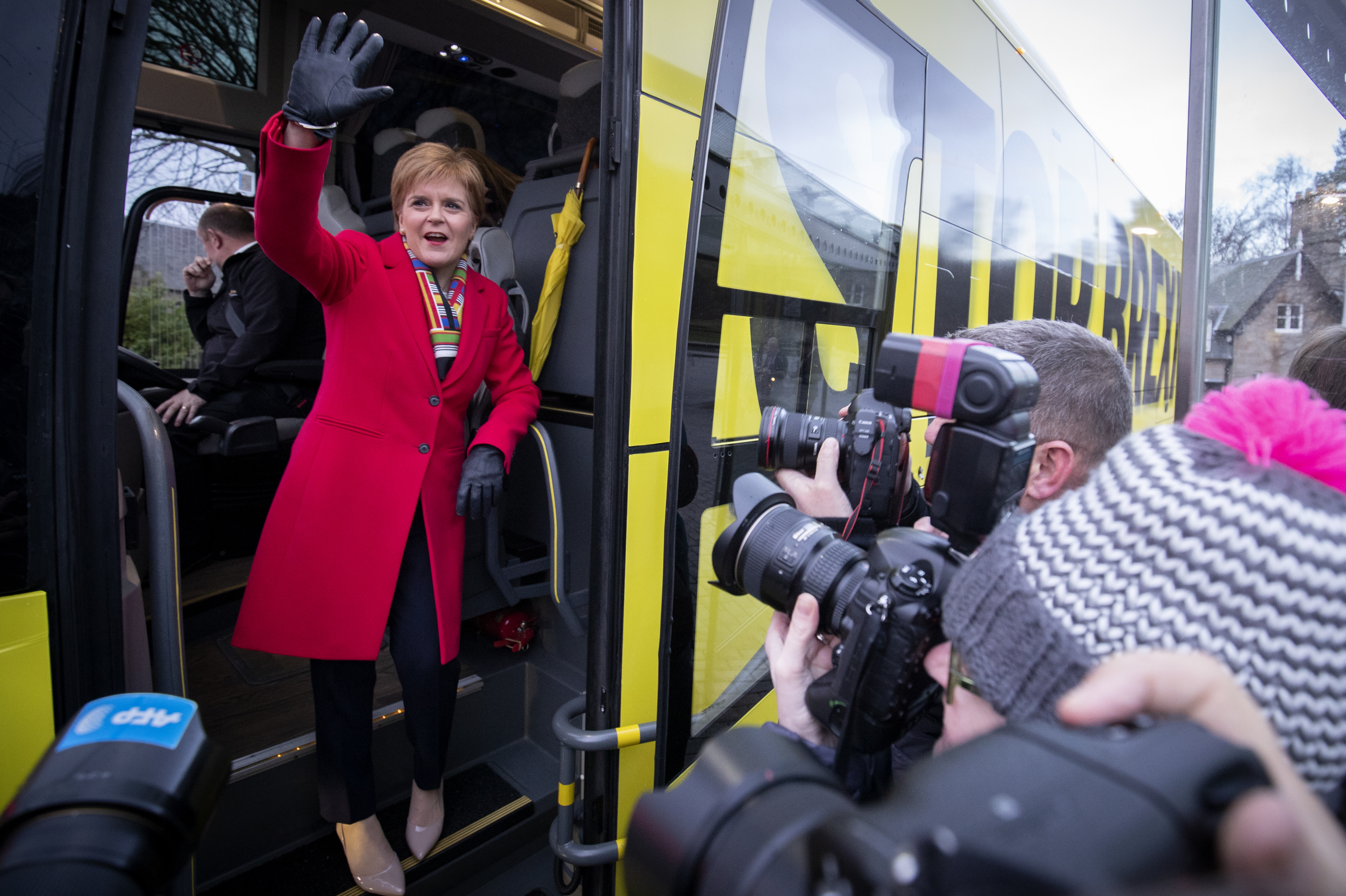 SNP leader Nicola Sturgeon boards the party's campaign bus outside the Scottish Parliament, Edinburgh, on the last day of the General Election campaign trail in 2019.