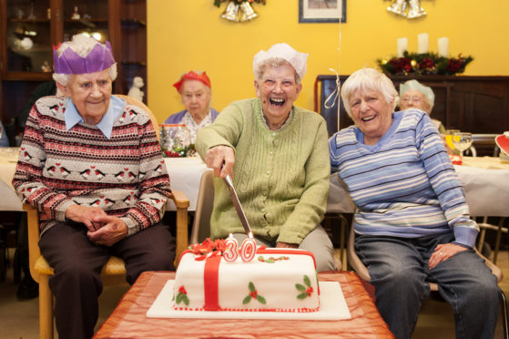 Picture shows, l to r, Ida Anderson, Jean Hardie and Meg Reid cutting the 30th Birthday cake to mark the 30th year of Seaton Grove care home.
